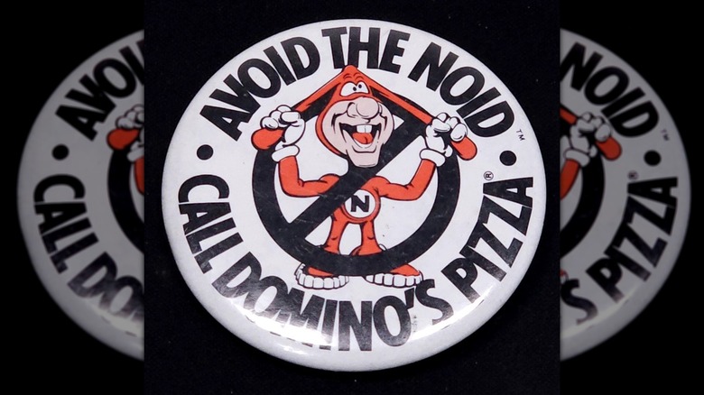 Domino's Noid mascot on a pinback button