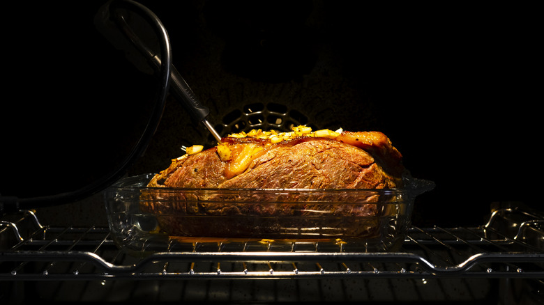 Slow cooking roast in an oven
