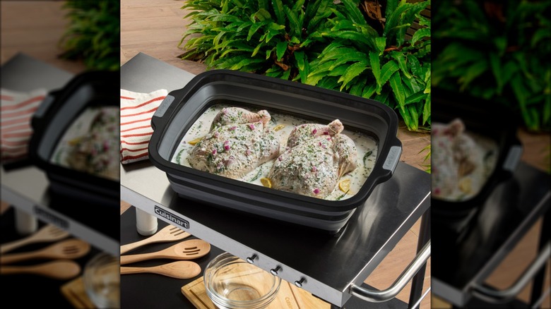 Two whole chickens marinate inside a Cuisinart 4-in-1 XL Expandable Prep and Serve Tub.