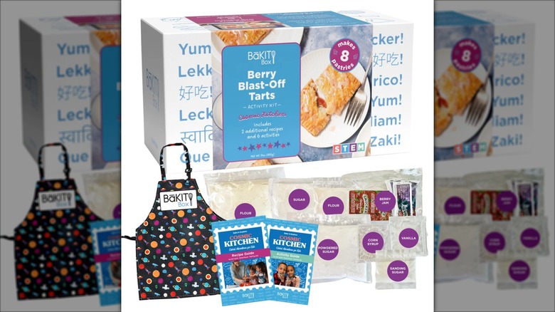 The elements of a BāKIT Box Berry Tarts Cosmic Kitchen Bake and Wear Bundle.