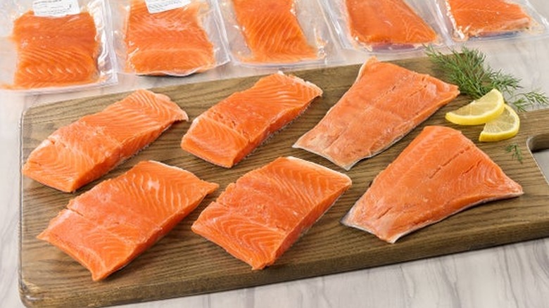 Steelhead trout sits on a cutting board.