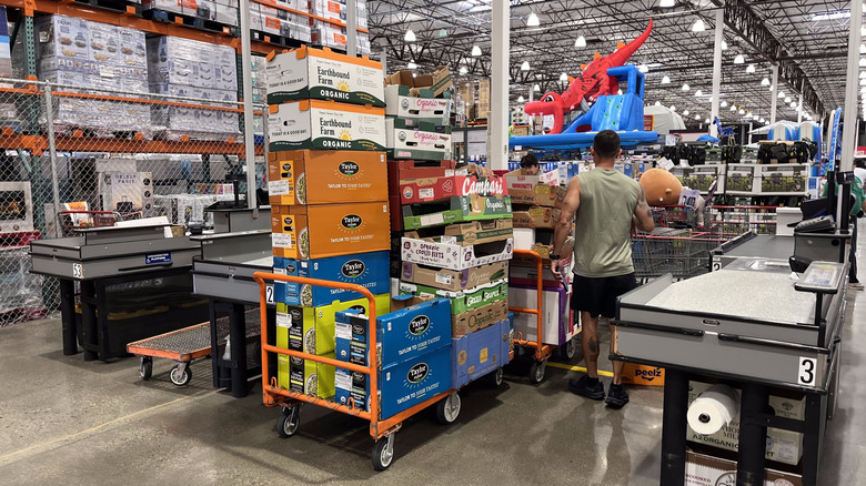 boxes at a checkout conveyor belt in a Costco.