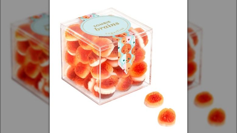 A cube of gummy candy sits against a white background.