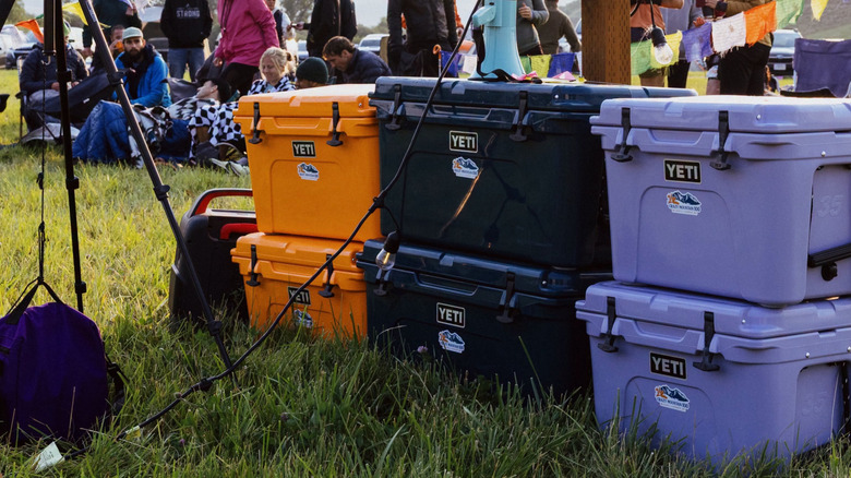 YETI coolers sit stacked on top of each other.