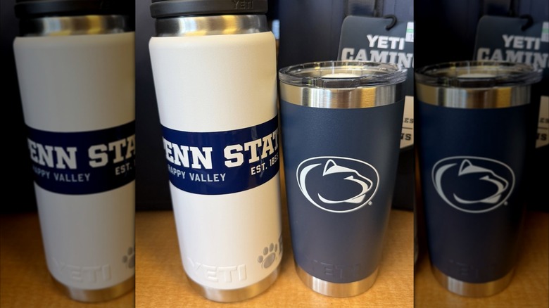 Penn State Yeti drinkware sit on a table.