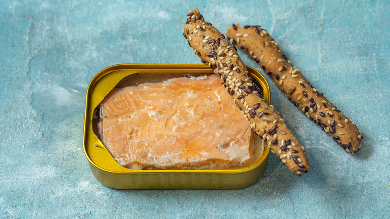 Canned salmon with sesame crackers on top