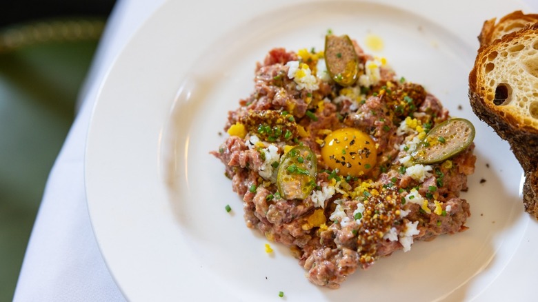 Steak tartare, garnished with egg