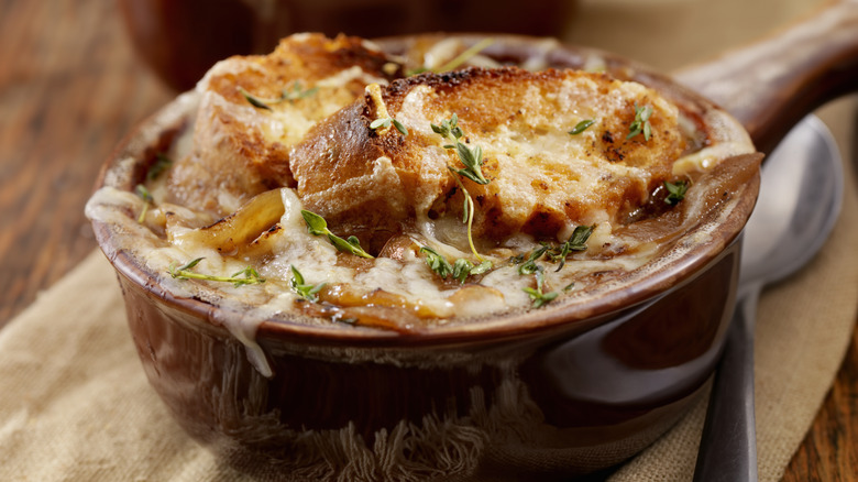 bowl of French onion soup with spoon