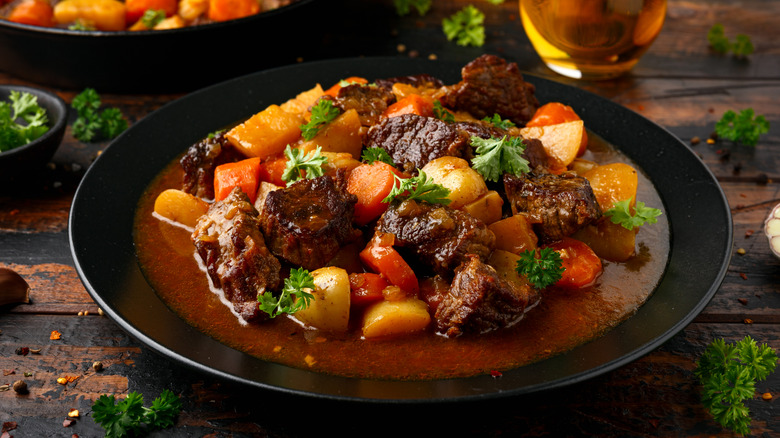 Beef stew crafted with carrots and potatoes.