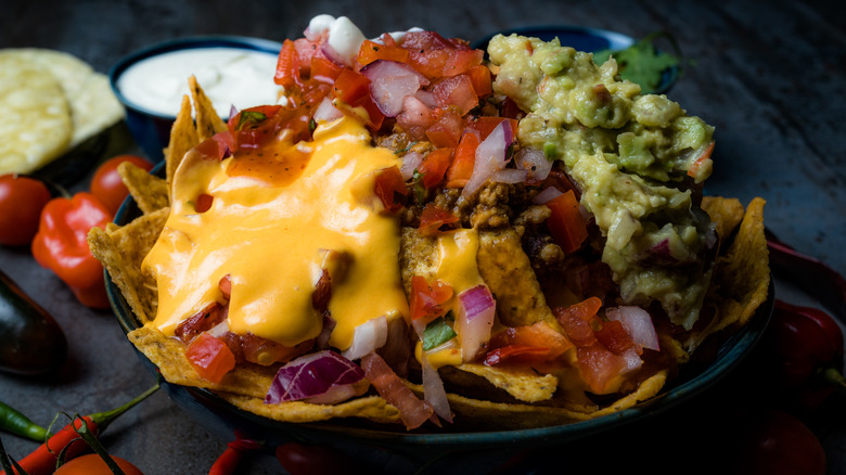 Nachos with queso, pico de gallo, guacamole