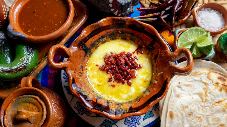 Mexican queso fundido with chorizo, tortillas, and salsa