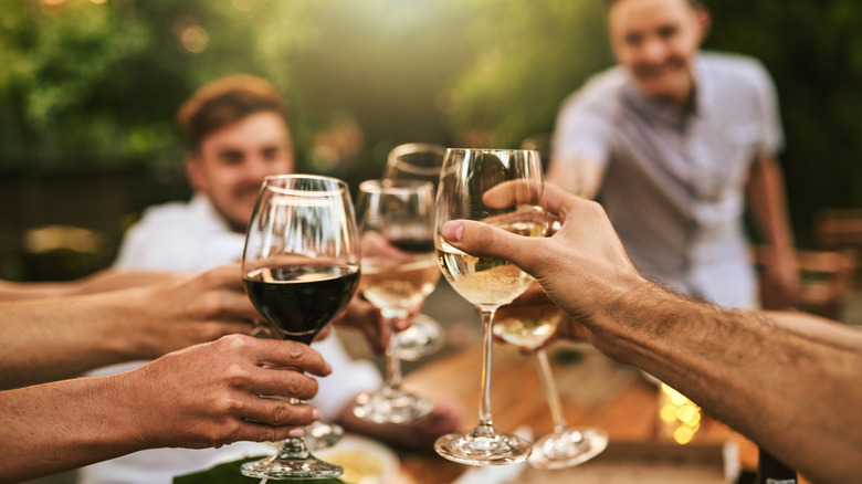 group toasting with wine
