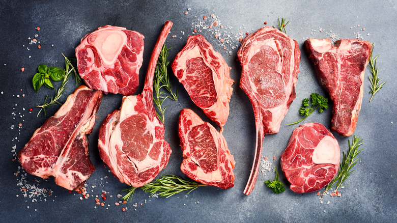 A variety of raw steak cuts.