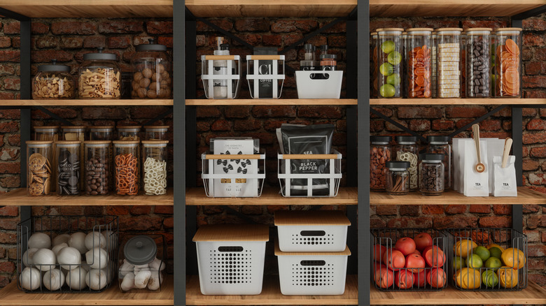 containers of pantry staples on kitchen shelves