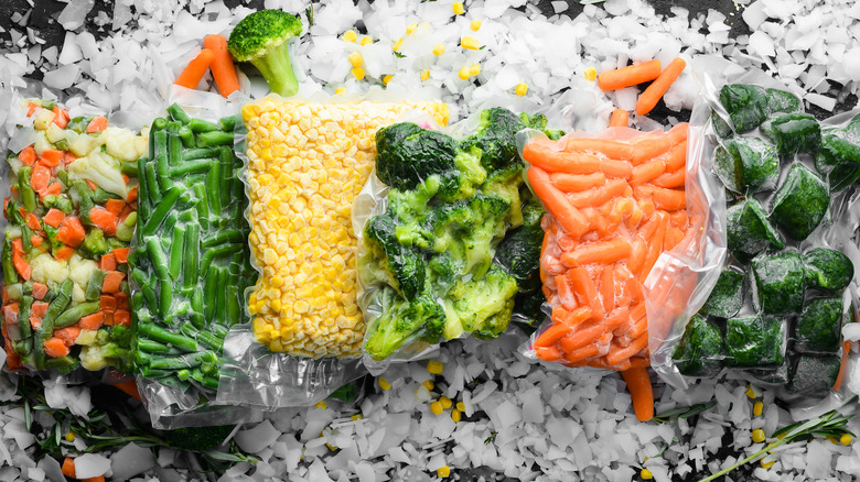 assortment of frozen vegetable bags on ice