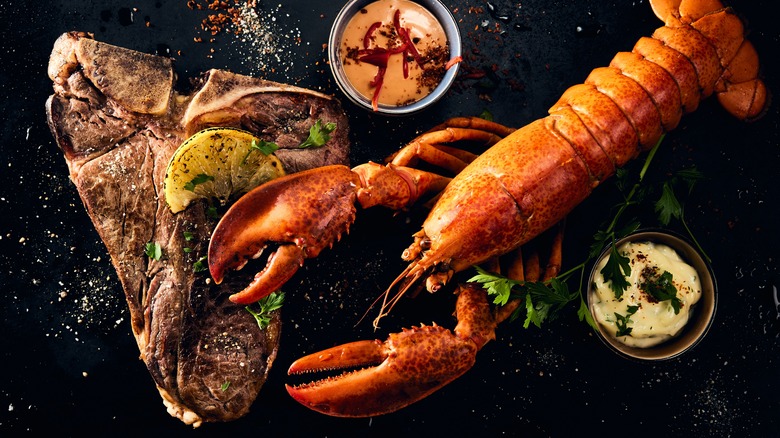 Steak and lobster with dipping sauces