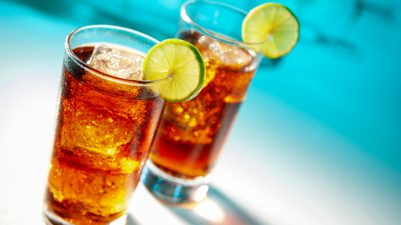 Cuba libre cocktails with lime garnish