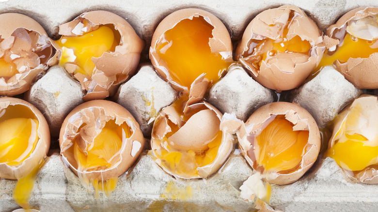 An egg carton full of broken eggs