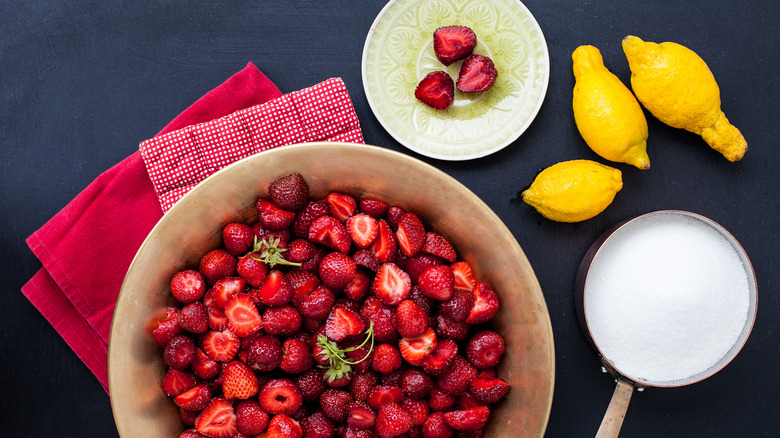 Raw ingredients for strawberry jam making
