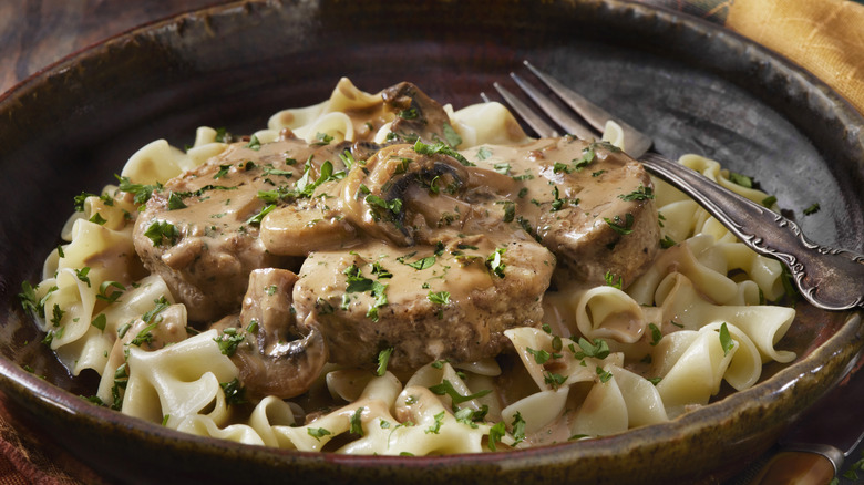 egg noodles with sauteed meat and mushrooms