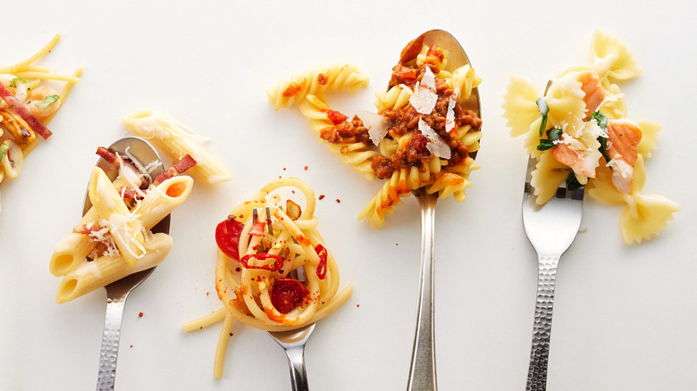pasta and sauce on various utensils
