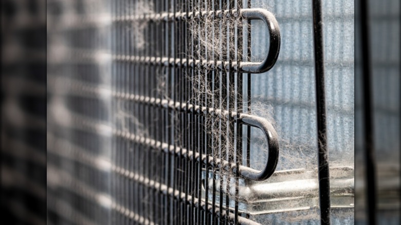 Close up of dirty refrigerator coils