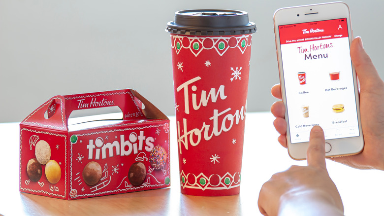 Timbits, cup of coffee, and ordering menu