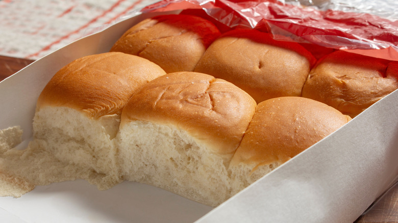 King's Hawaiian-style sweet rolls sit in their cardboard tray with the bag pulled away