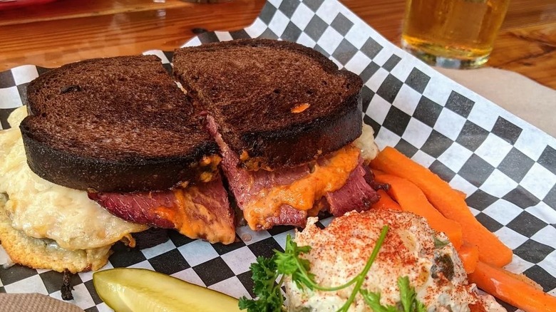 Goose Hollow Inn Reuben on a black and white checkered paper