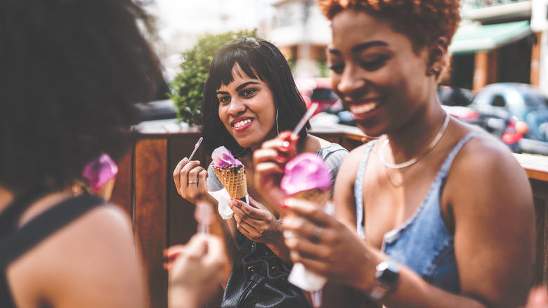 Friends eating pink ice cream