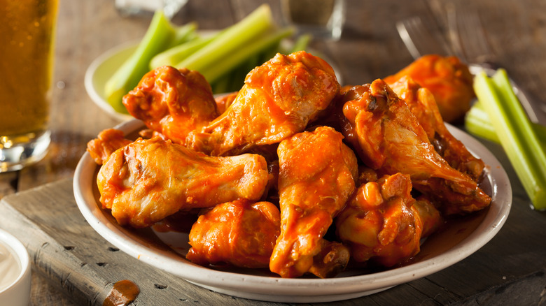 Buffalo wings served with celery sticks