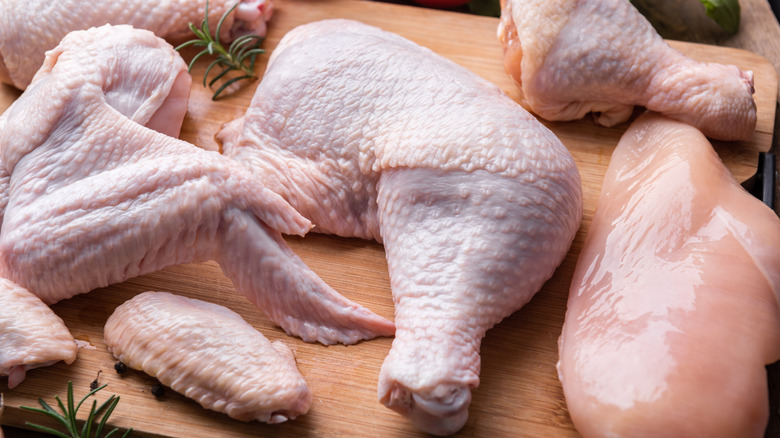 Various cuts of chicken on a cutting board