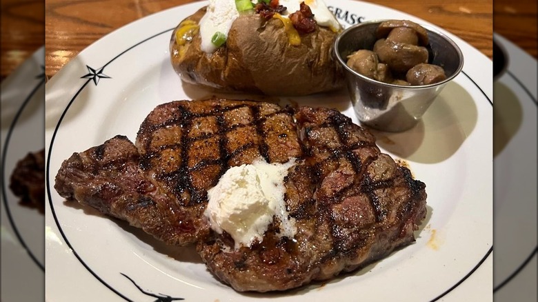 Steak, mushrooms, and baked potato