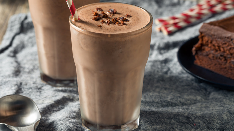 Homemade chocolate milkshakes with cake crumble garnish