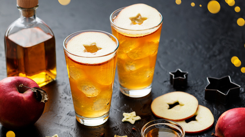 Whiskey cocktail with slices of apple