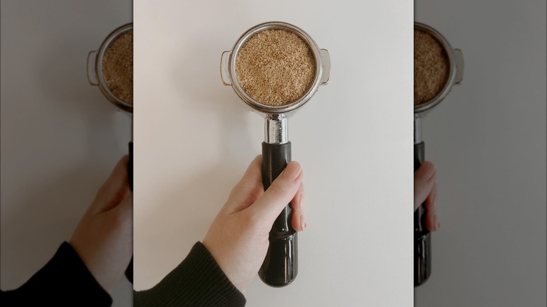 Espresso machine portafilter with untamped ground white coffee