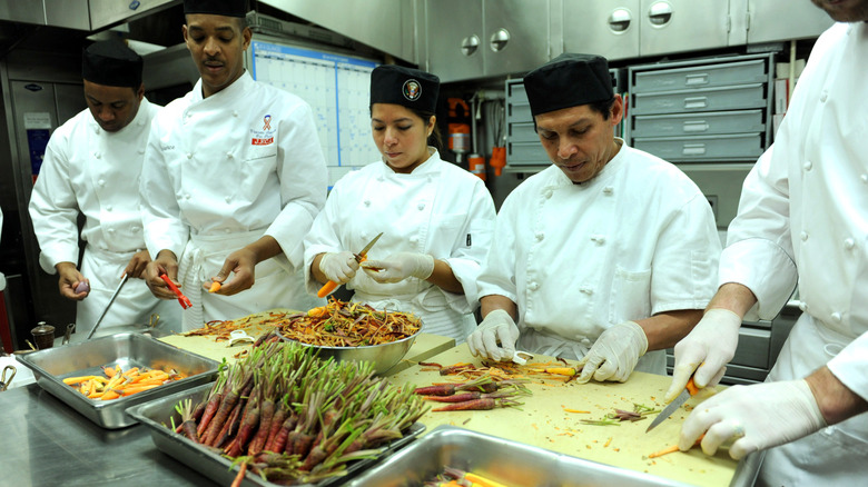 White House chefs chopping and peeling carrots