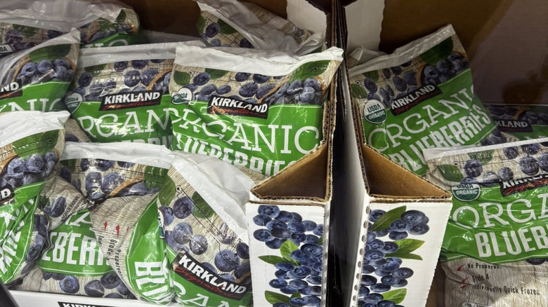 Bags of Kirkland Signature frozen blueberries sit in a freezer in Costco
