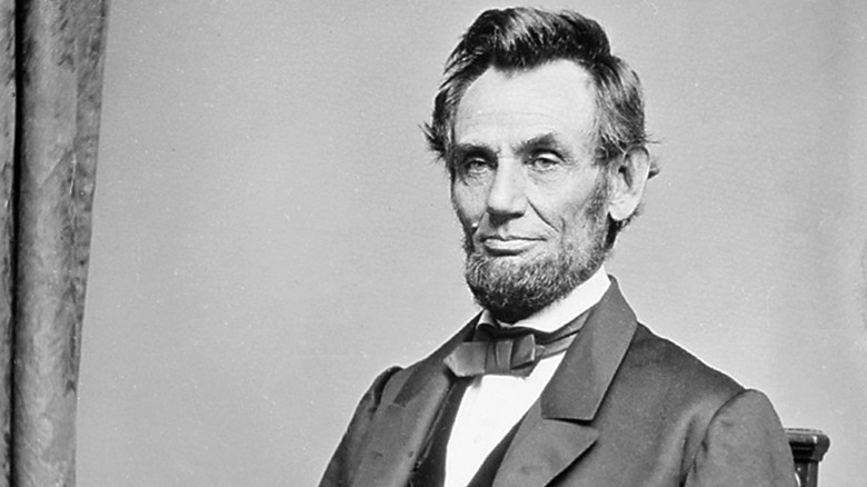 President Abraham Lincoln gazes out while seated