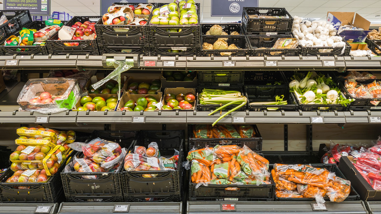 Plastic wrapped fruits and vegetables in an Aldi.