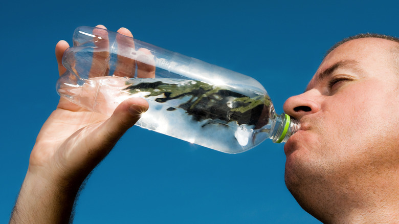Man chugging water