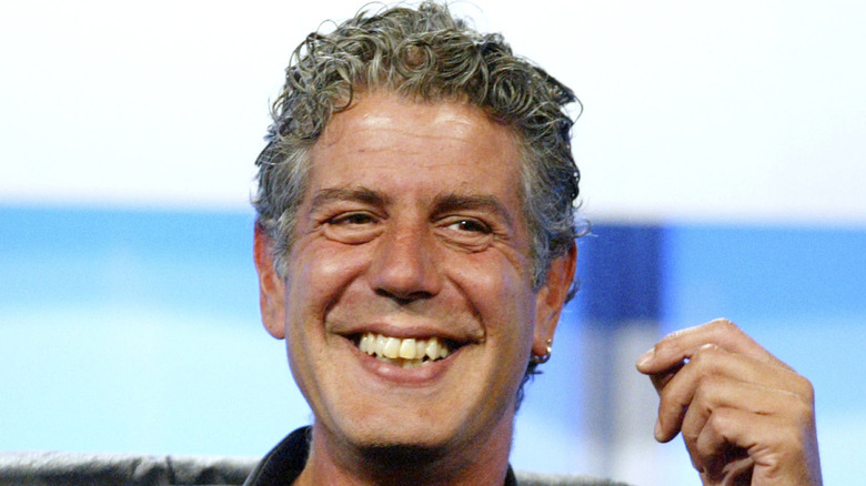 Anthony Bourdain smiling on stage