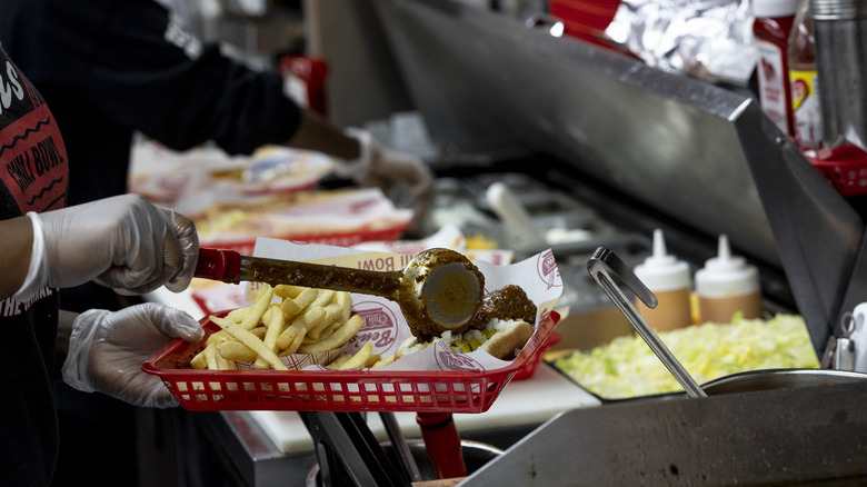 Half-smoke hot dog being prepared at Ben's Chili Bowl