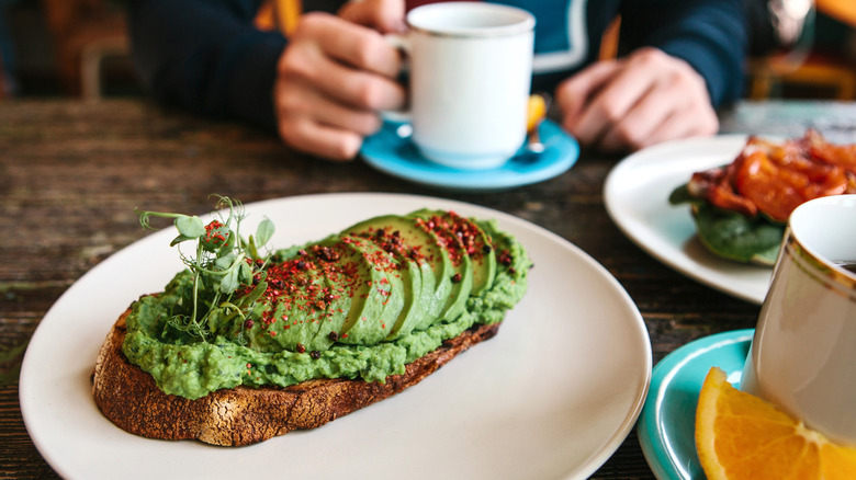 Avocado on a slice of sourdough at a cafe