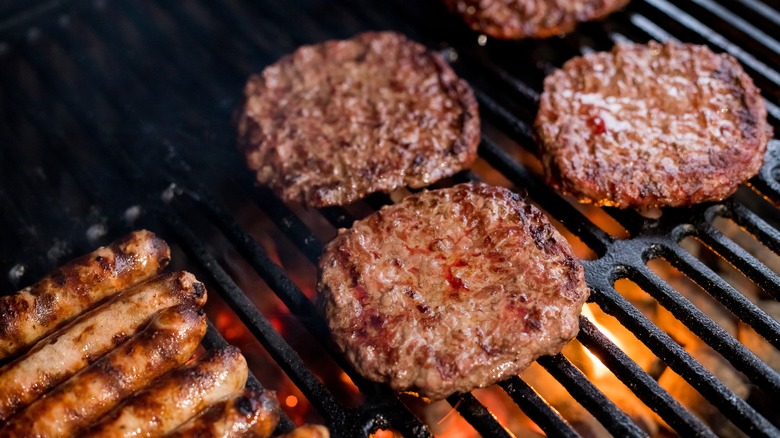 burger patties cooking on the grill