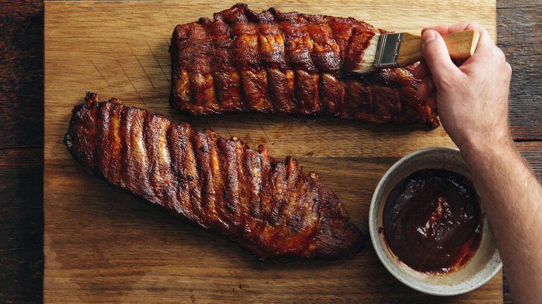 Baby back pork ribs brushed with barbecue sauce