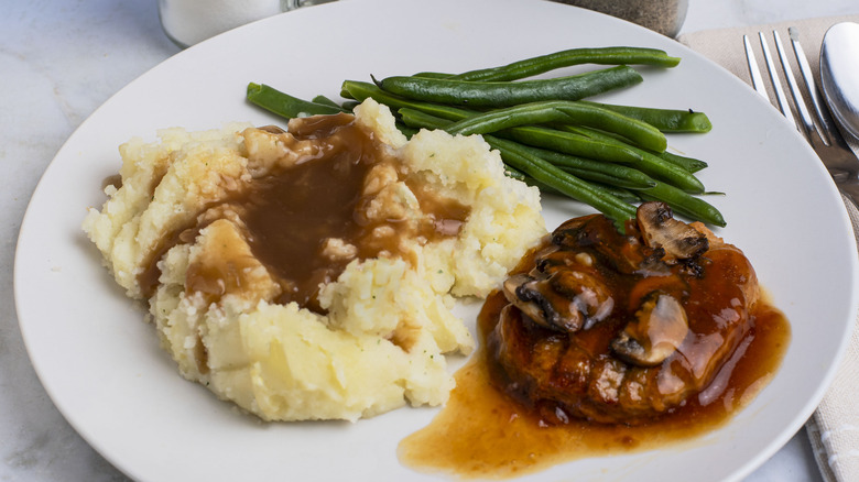 Salisbury steak served with mashed potatoes.