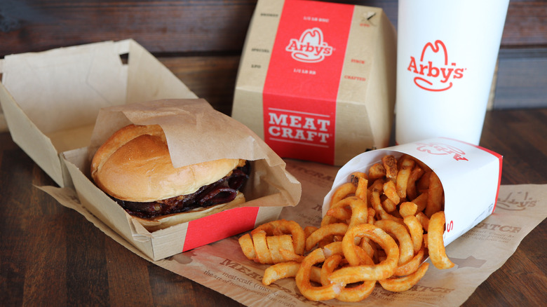 Arby's curly fries, sandwich, and drink.