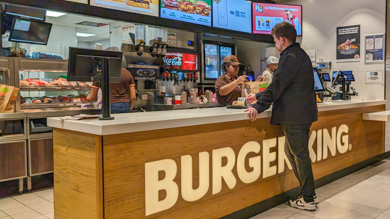 Man standing at a Burger King counter