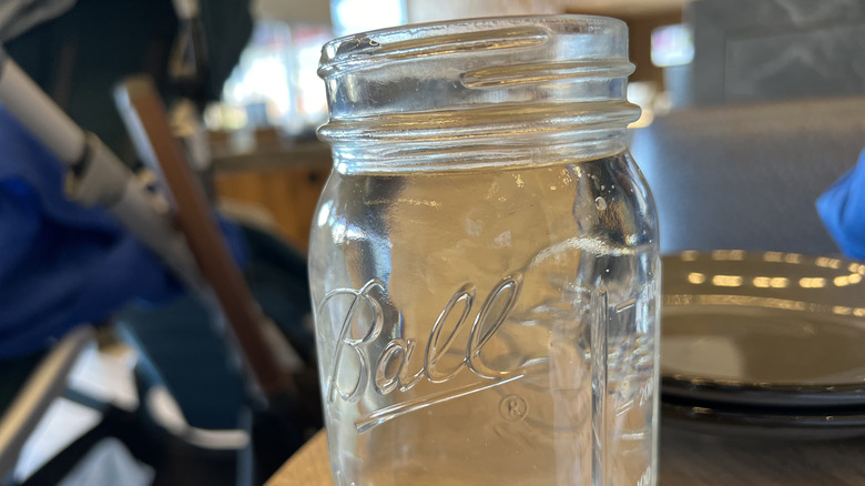 a close-up of water in a mason jar